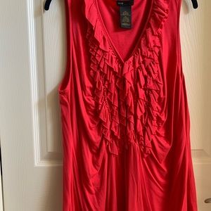 Sleeveless top, with ruffles down front.Vivid red color.